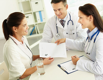Doctors giving health paperwork to patient
